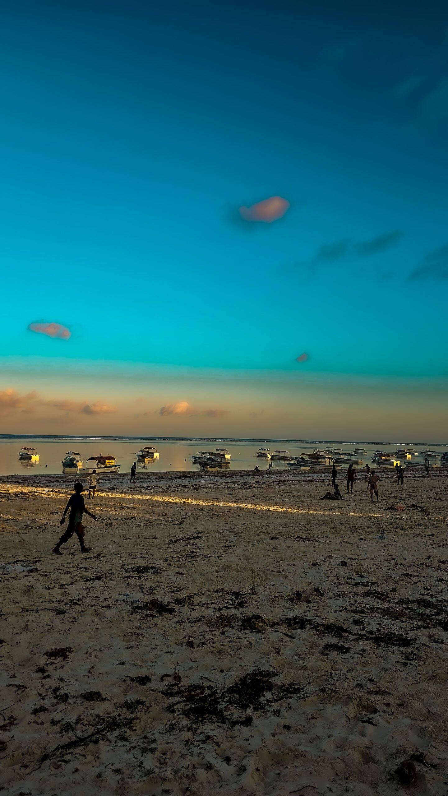 Zanzibar: Kids playing soccer at sunset on Matemwe Beach